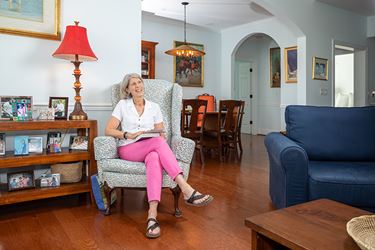 A Resident Sitting In Her Expansive Living Space