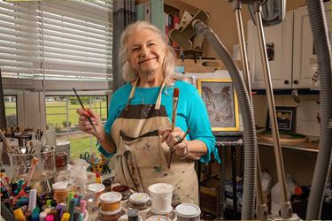 An Azalea Trace Resident Painting In The Art Studio