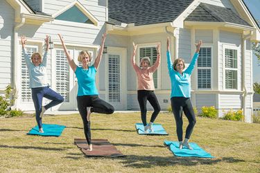 Group Of Acts Residents Doing Yoga Together