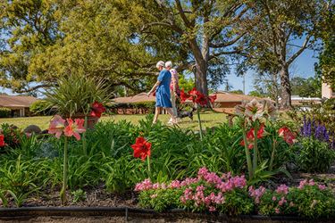 Two Friends Walking At Azalea Trace