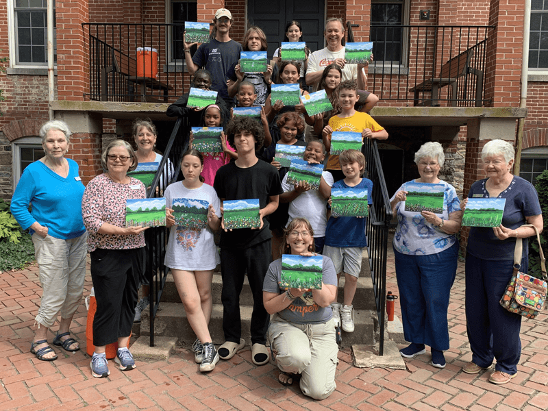 Buckingham's Choice residents volunteer at children's camp.